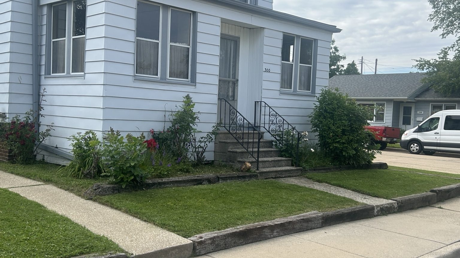 Front yard lawn with cared-for entry landscape